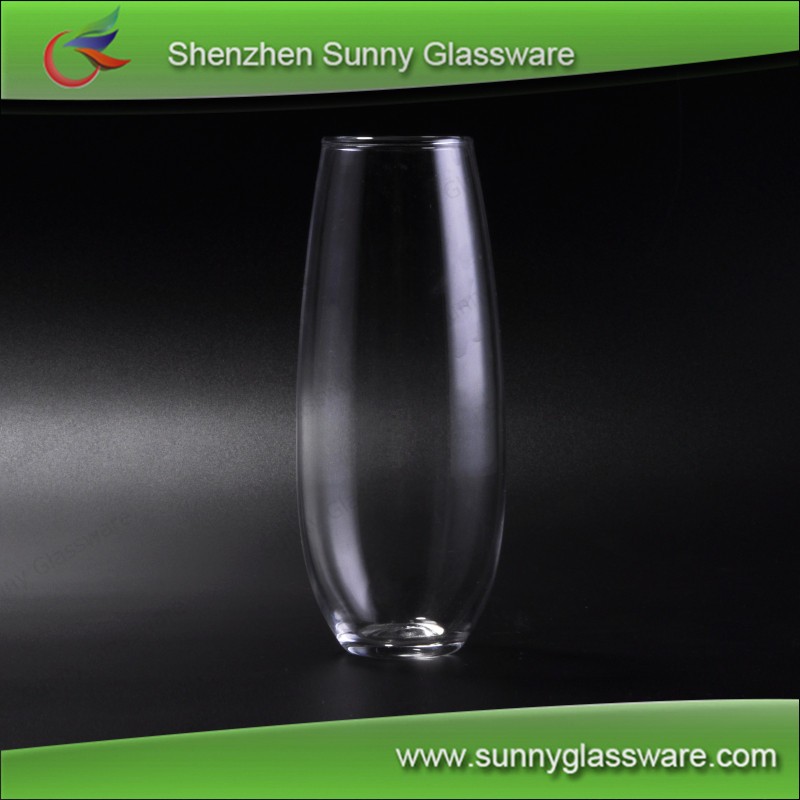 transparent tall drinking glass used for home goods